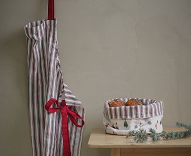 Christmas bread basket and apron hanging up