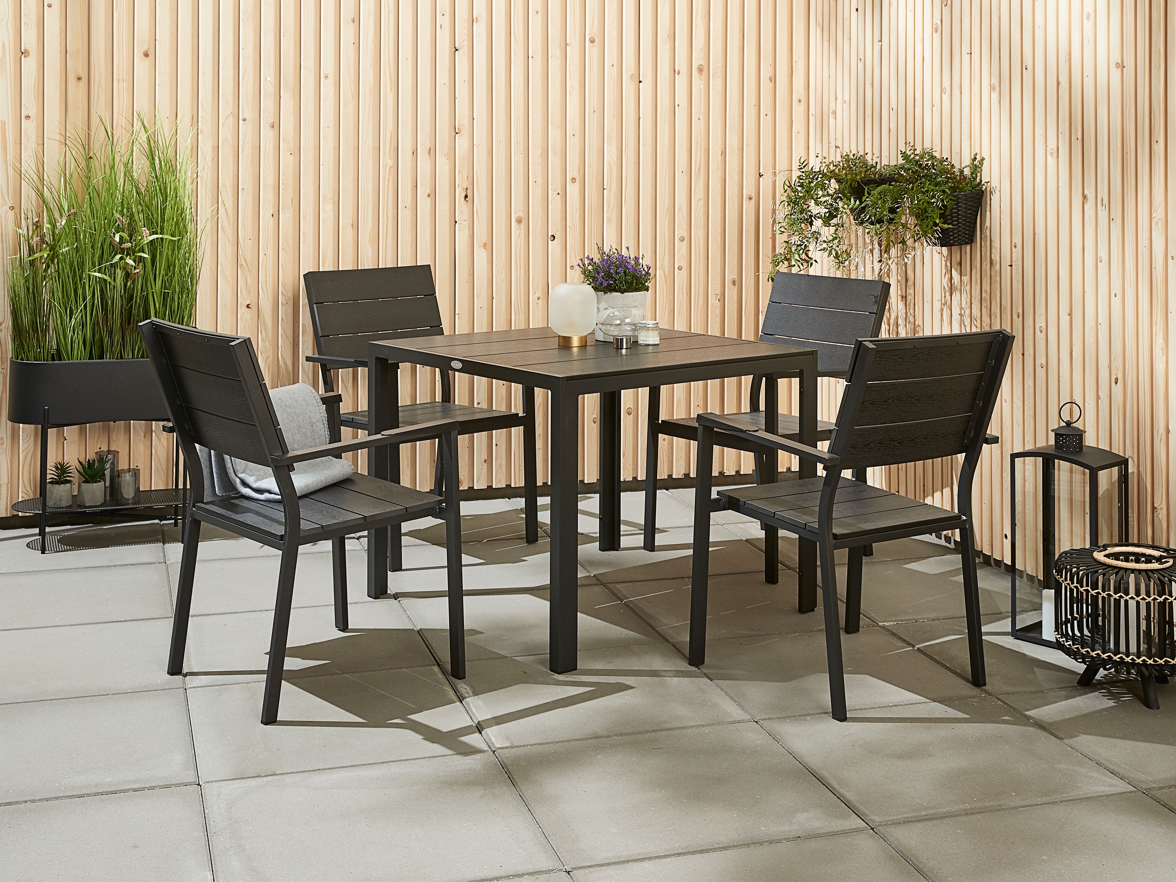 Square artwood table in black with black garden dining chairs
