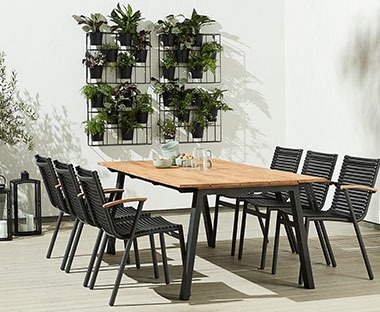 Wooden plank garden top table with sturdy black metal legs 