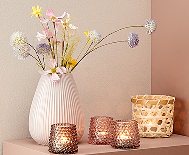 pink and peach toned glass tealight holders with embossed glass