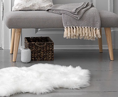 A faux fur rug in white
