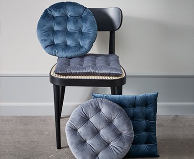Petrol blue and grey circular and square seat cushions with quilted design