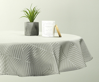 Grey round table cloth with striped geometric design
