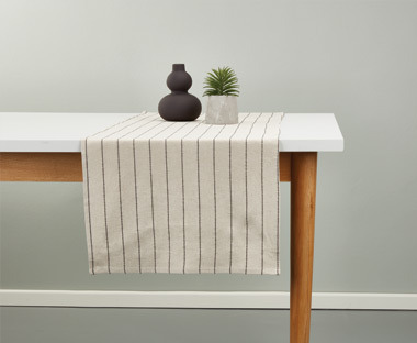 Table runner on top of wooden table