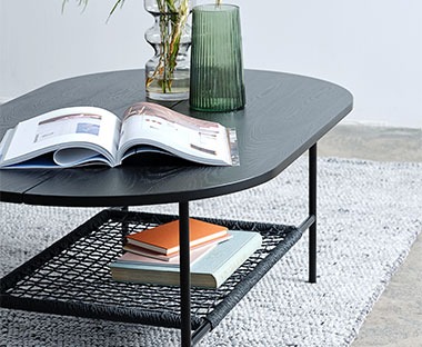 Black wooden coffee table with magazine rack