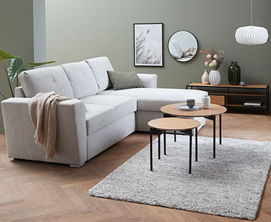 VEJLBY Sofa with two decorative coffee tables in a living room