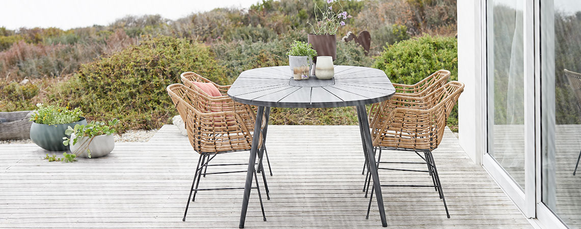 Garden dining set on a patio in the rain