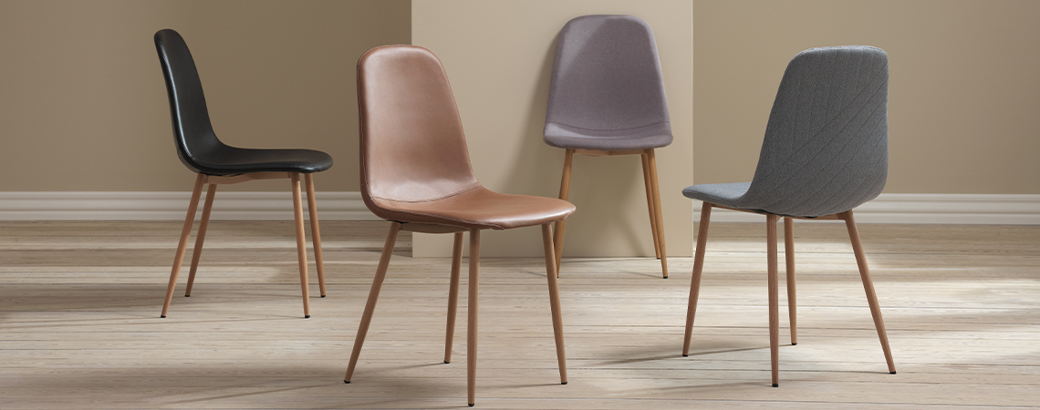 Shell chair type dining room chairs in black, grey, cognac, and light blue with oak-look legs 