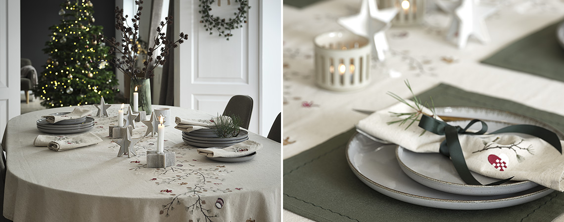 Dining table decorated for a Christmas dinner and place setting with fabric napkin