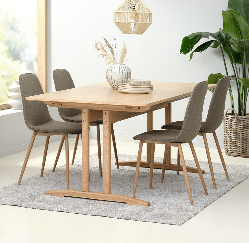 Olive green dining chairs and dining table in living room 