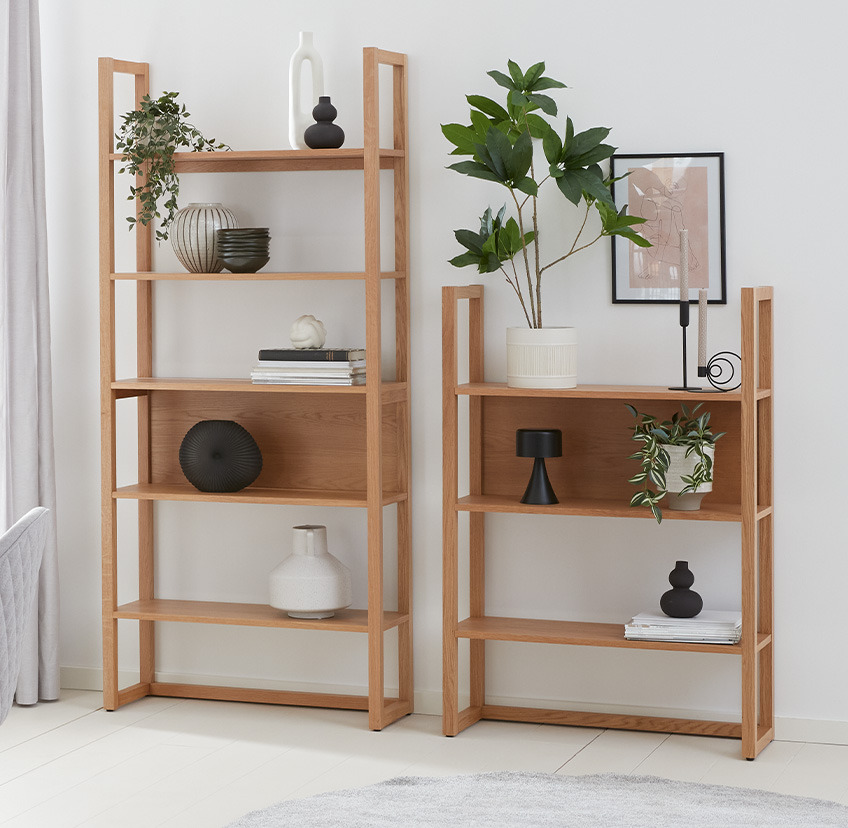 Two minimalistic oak bookcases with three and five shelves 