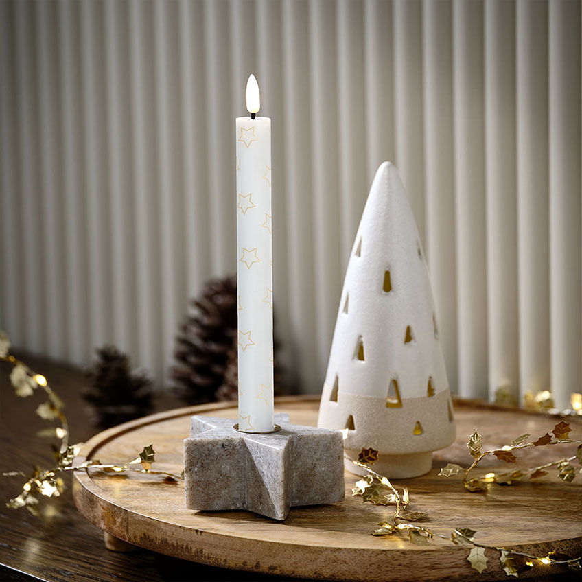 Star-shaped candle holder in marble, Christmas LED candle with stars, and LED-lit Christmas tree