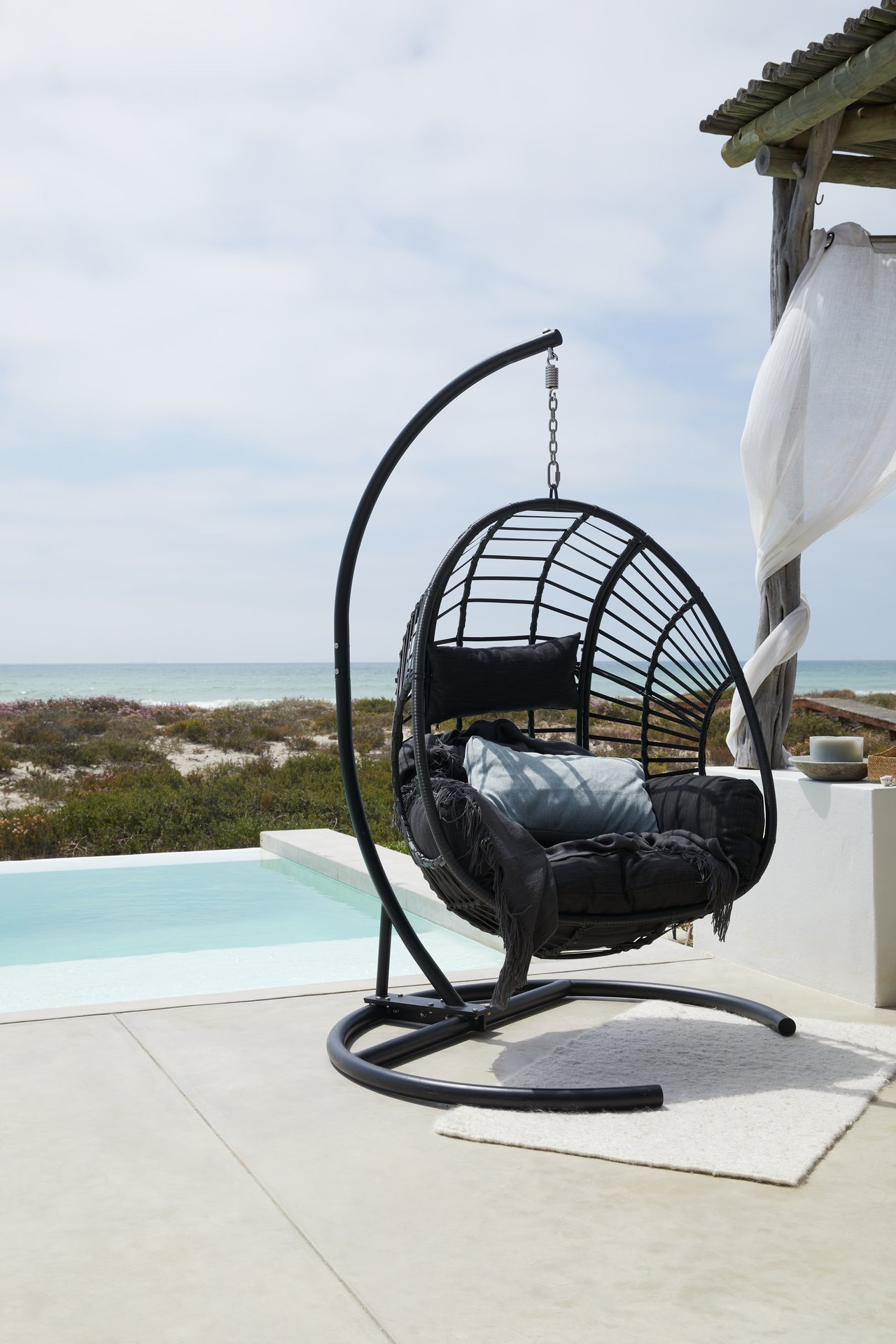 Outdoor hanging chair on patio