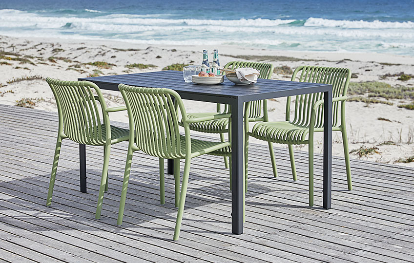 Artificial wood garden table and moulded plastic garden chairs