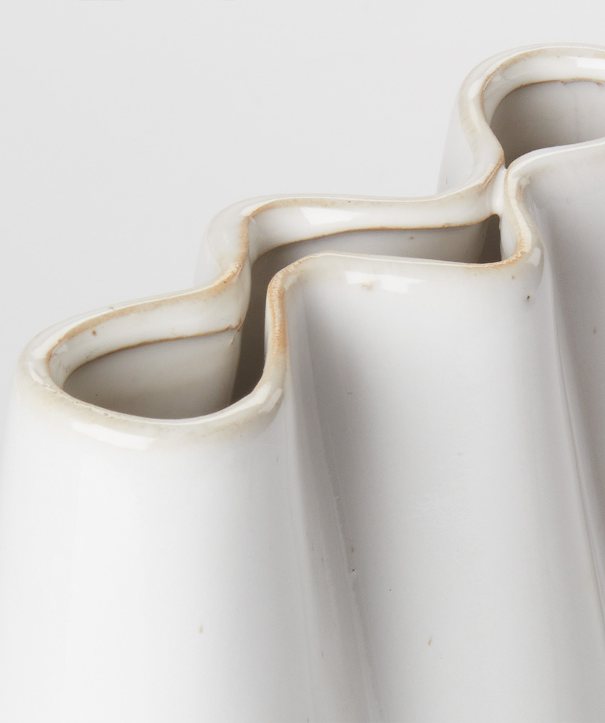 Organic modern white vase with flowing, wavy edges