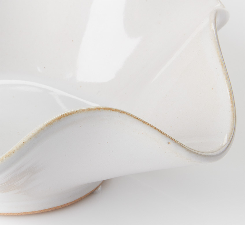 White bowl with wavy edges and organic curves