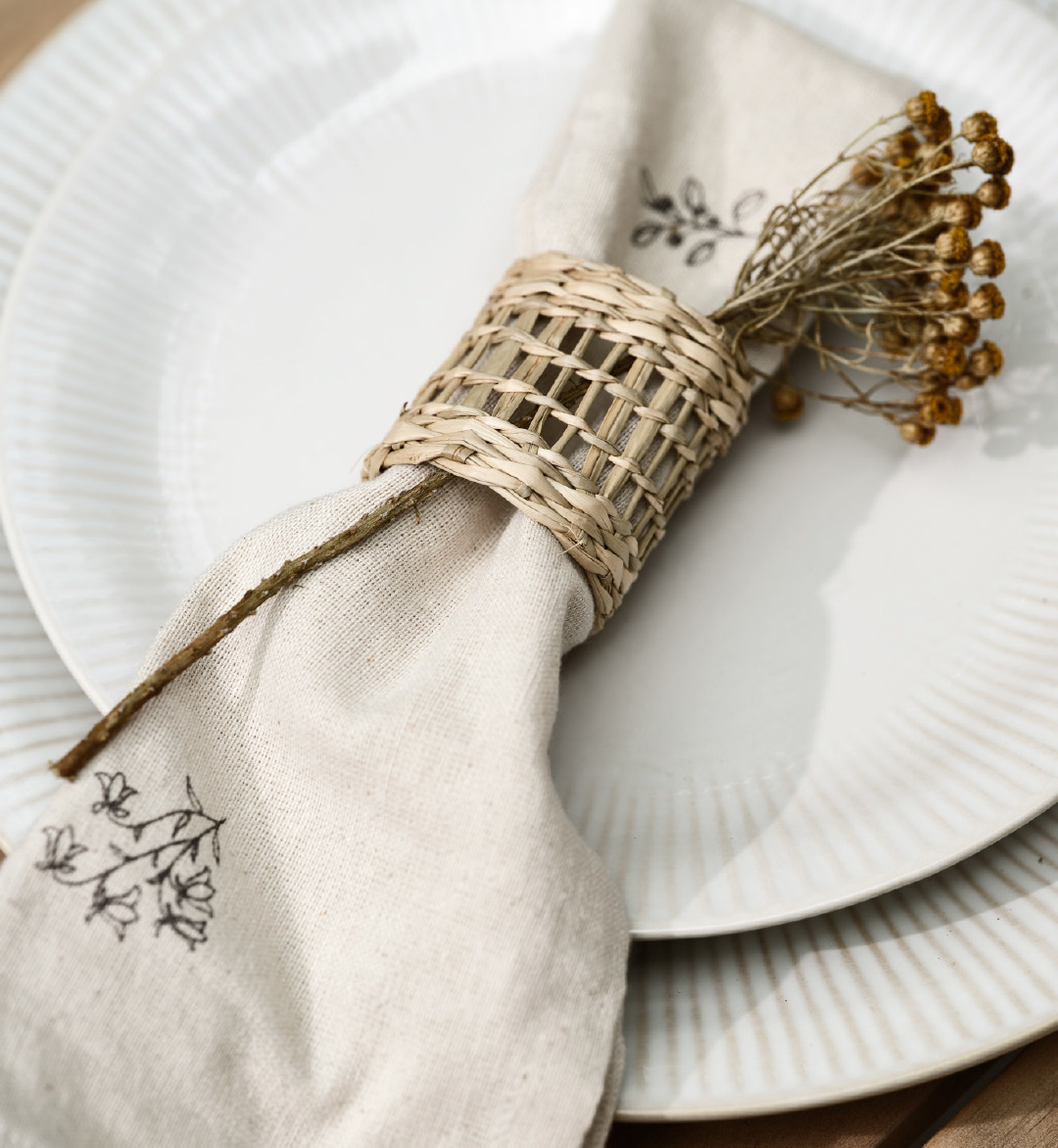 Cloth napkin and napkin ring on dinner plate
