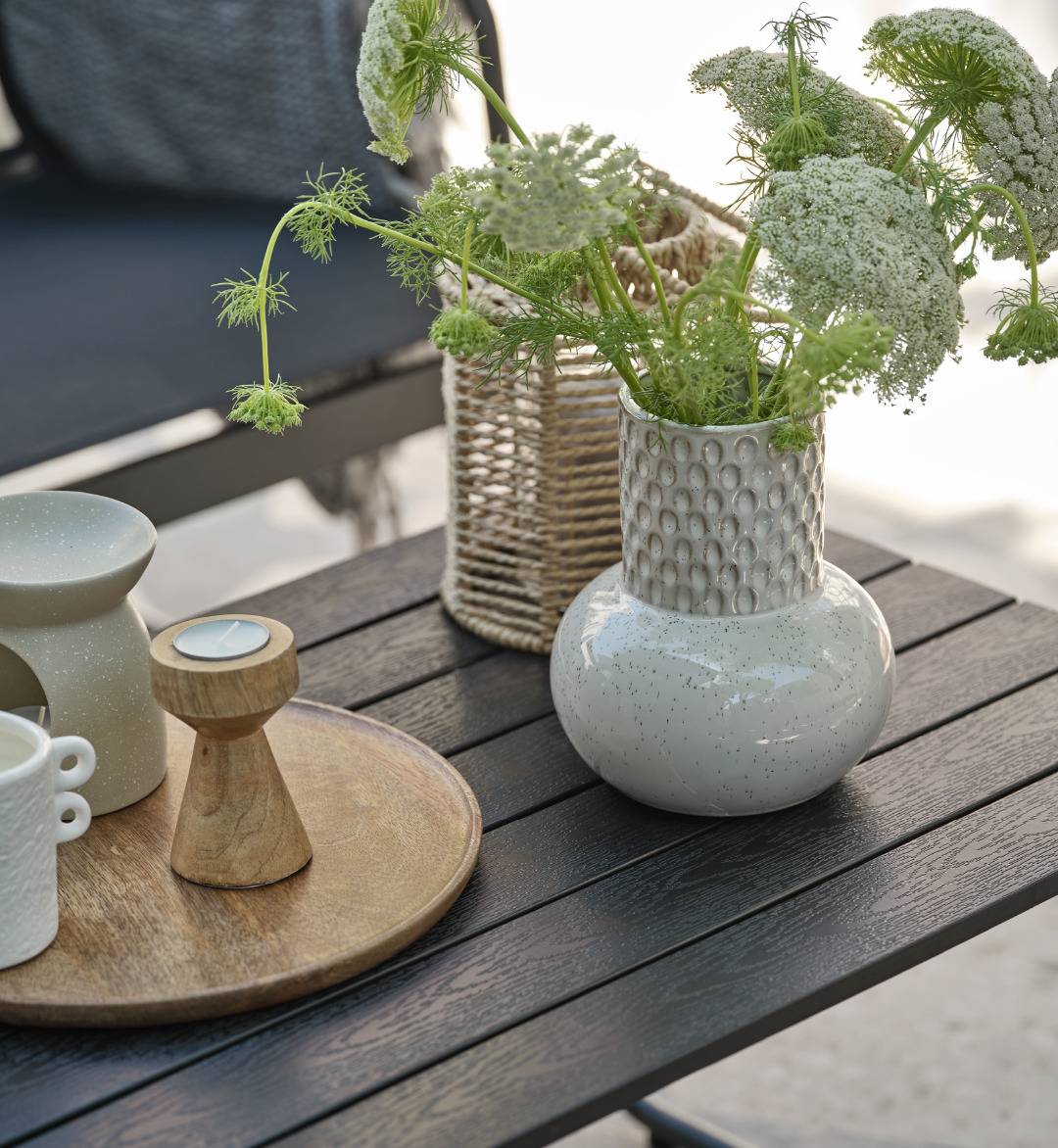 Vase, lantern, decorative, and tealight holder on outdoor table