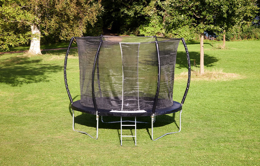 Small trampoline with ladder, padded edges, and safety net 