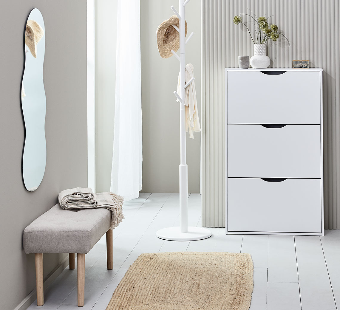 Hallway with hallway bench and shoe cabinet in light colours