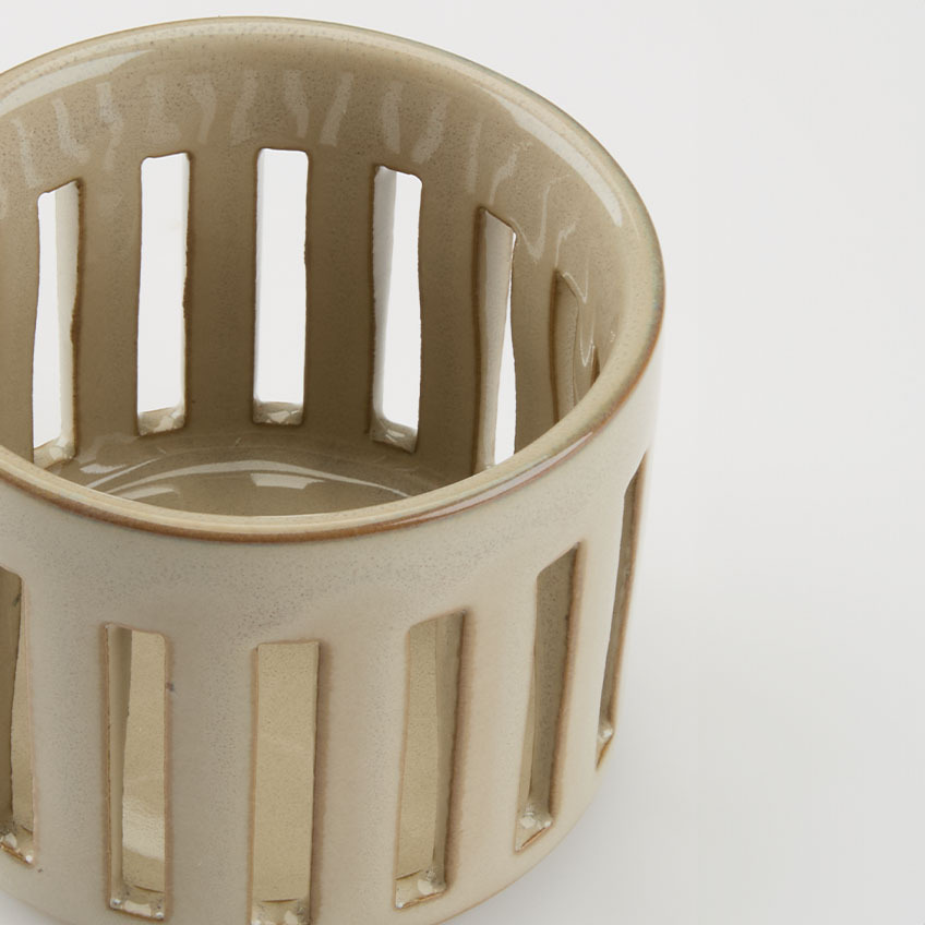 Close-up image of tealight holder with slits 