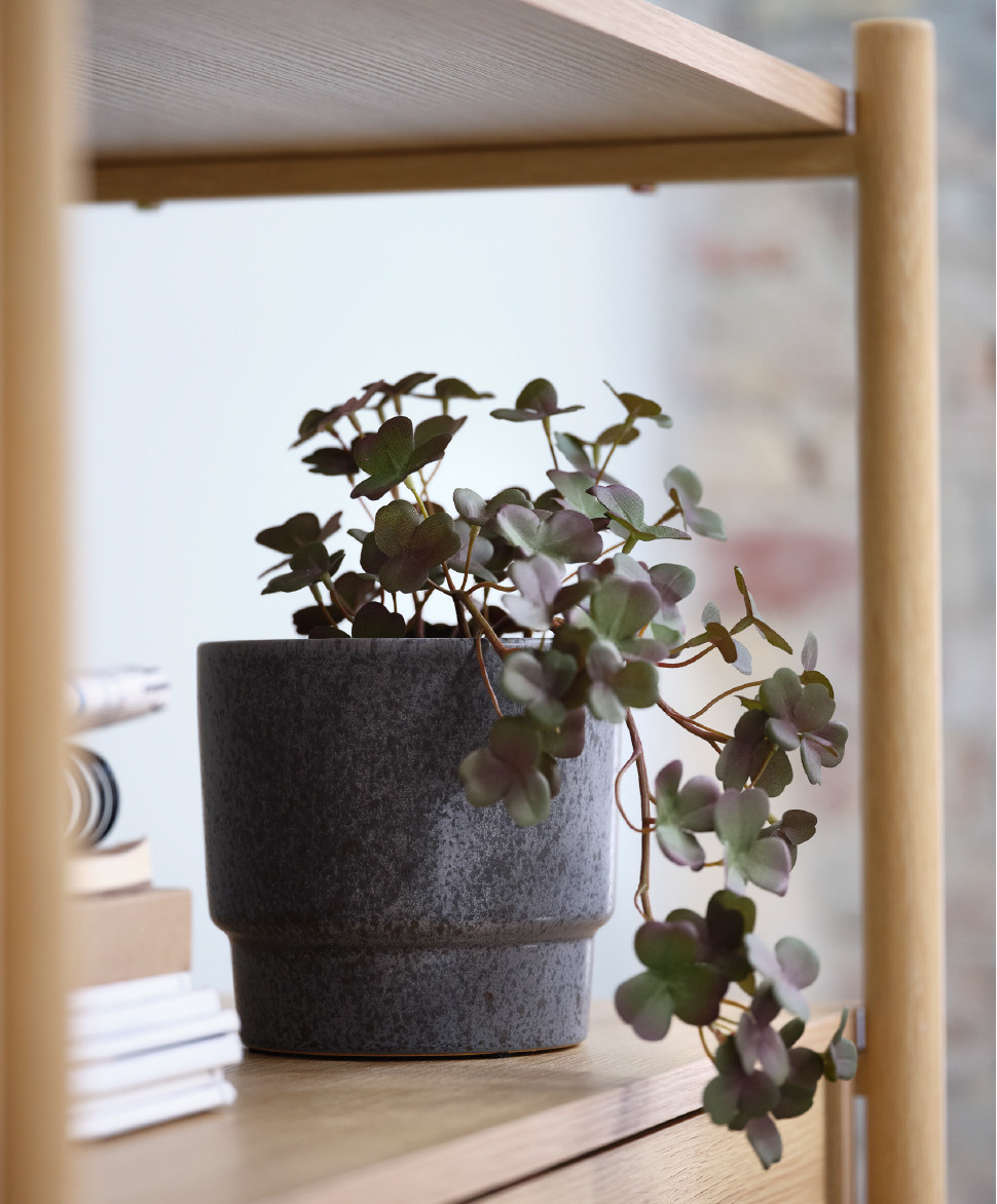 Artificial plant in grey monochrome plant pot