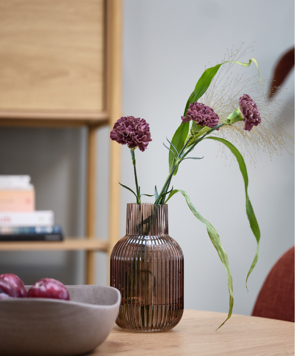 pink transparent vase with ribbed detials