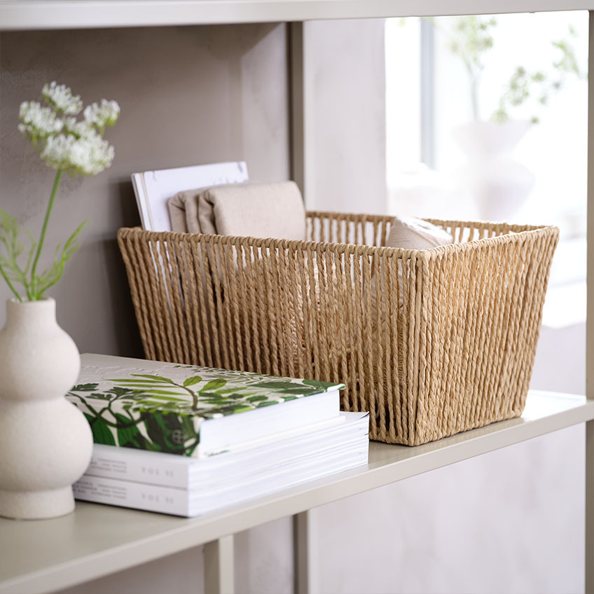 Storage basket made with paper strands that are braided