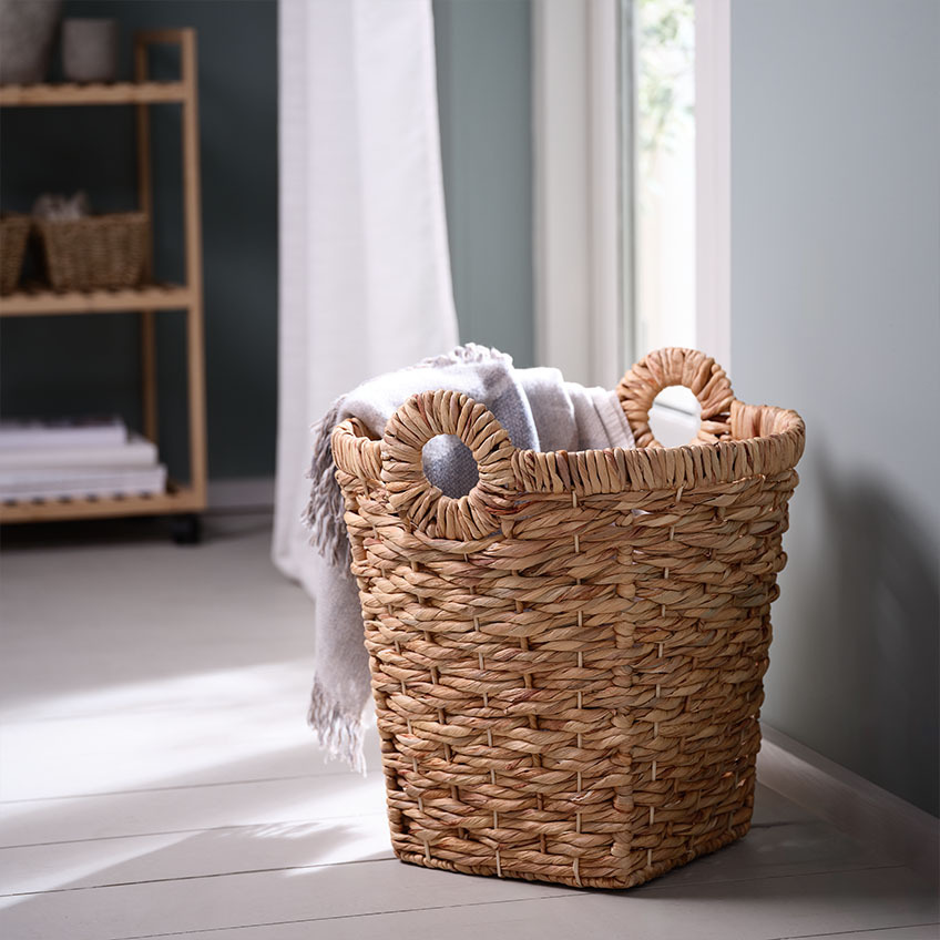 Woven wicker basket made from water hyacinth with handles 