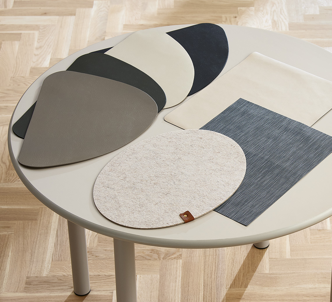 Round dining table with square and round place mats 