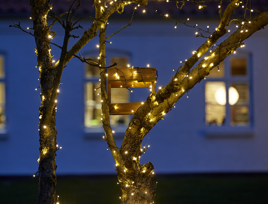 Light string wrapped around a tree 