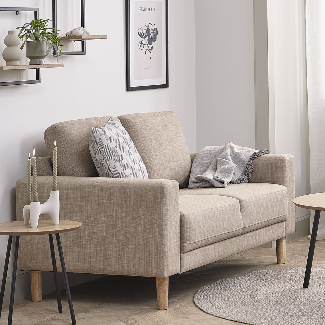 Beige 2-seater sofa in a cozy corner