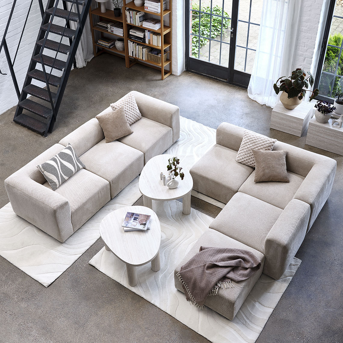 Beige modular sofa centralised in a large living area