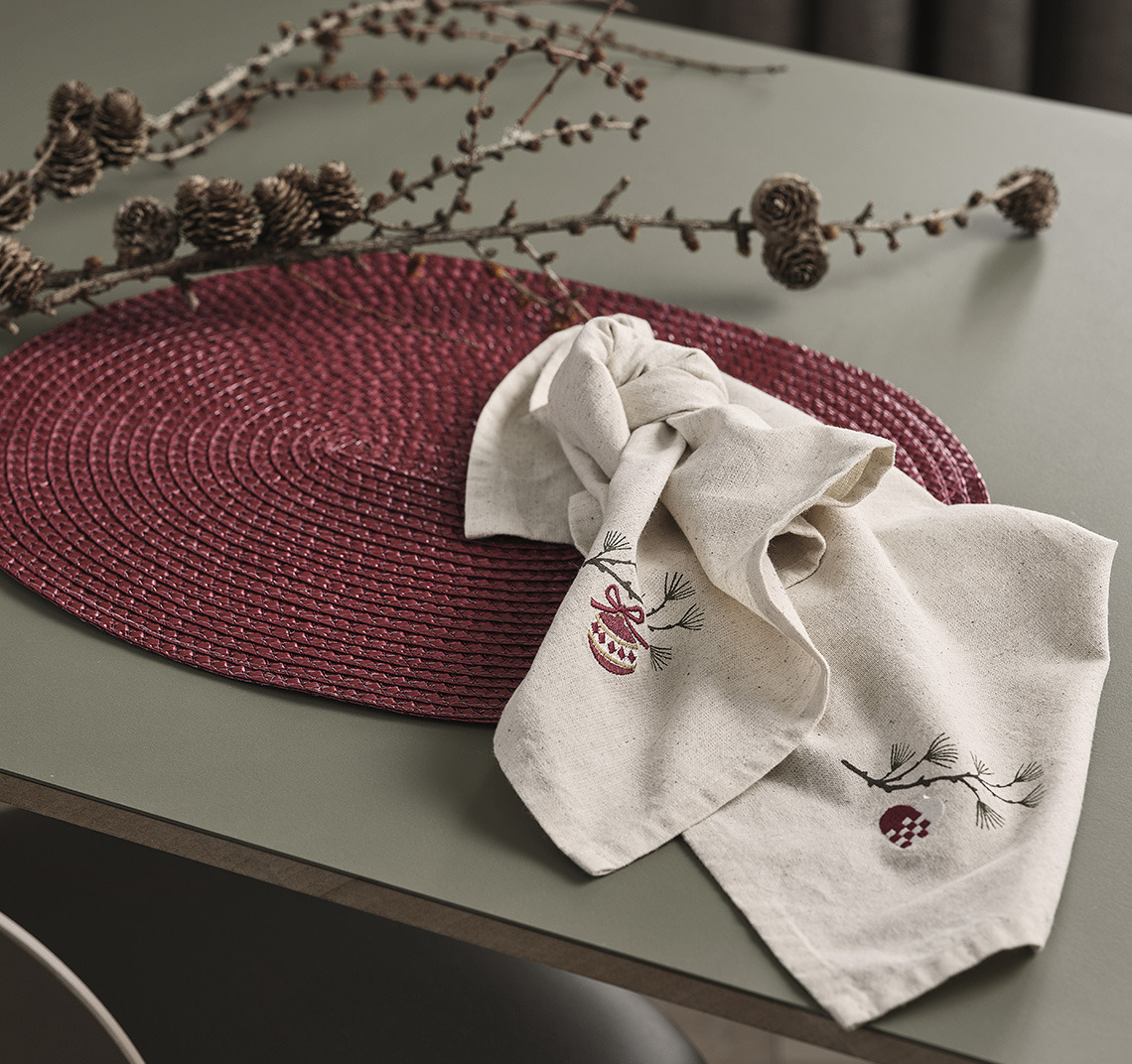 Red placemat and cloth napkins on a table