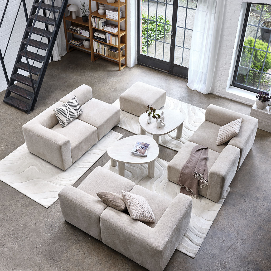 Beige modular sofa split into different modules in a living room area