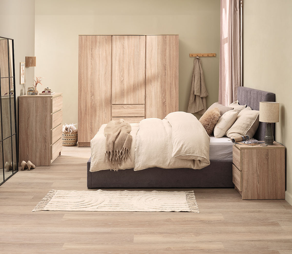 3-door wardrobe with doors and drawers in light oak colour in bedroom