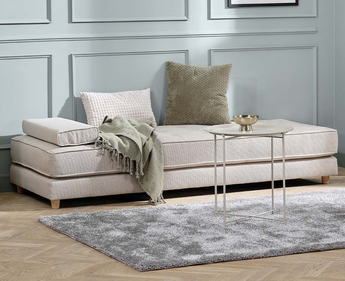 Beige daybed with armrest cushions