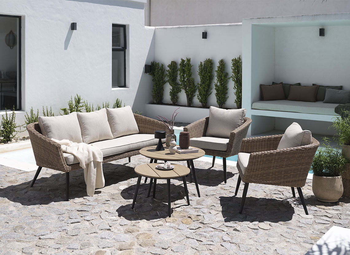 Garden lounge set in polyrattan on a patio