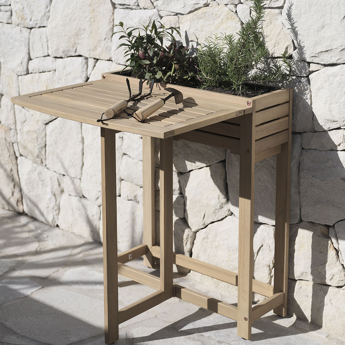 VANDREFALK folding table Folding table in hardwood with a built-in planter box standing on a patio