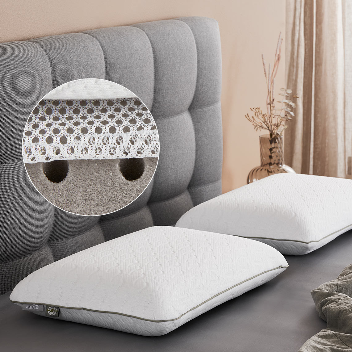 VONGSEN memory foam pillows have punch holes in the filling Two memory pillows on a bed with punch holes in the filling