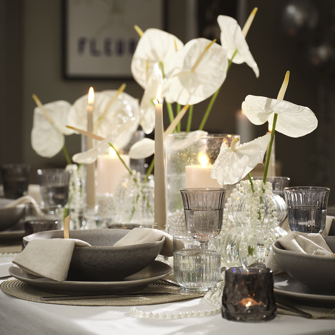 Table set with bowls, plates, glasses and tealight candle holders