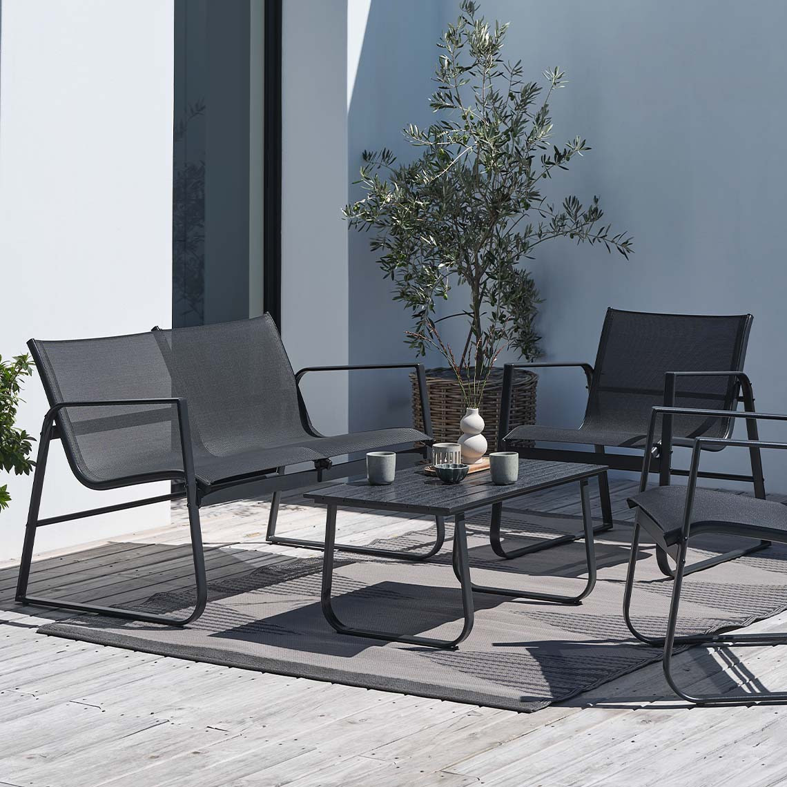 HORNSLET maintenance-free garden lounge set Maintenance-free garden lounge set in black on patio