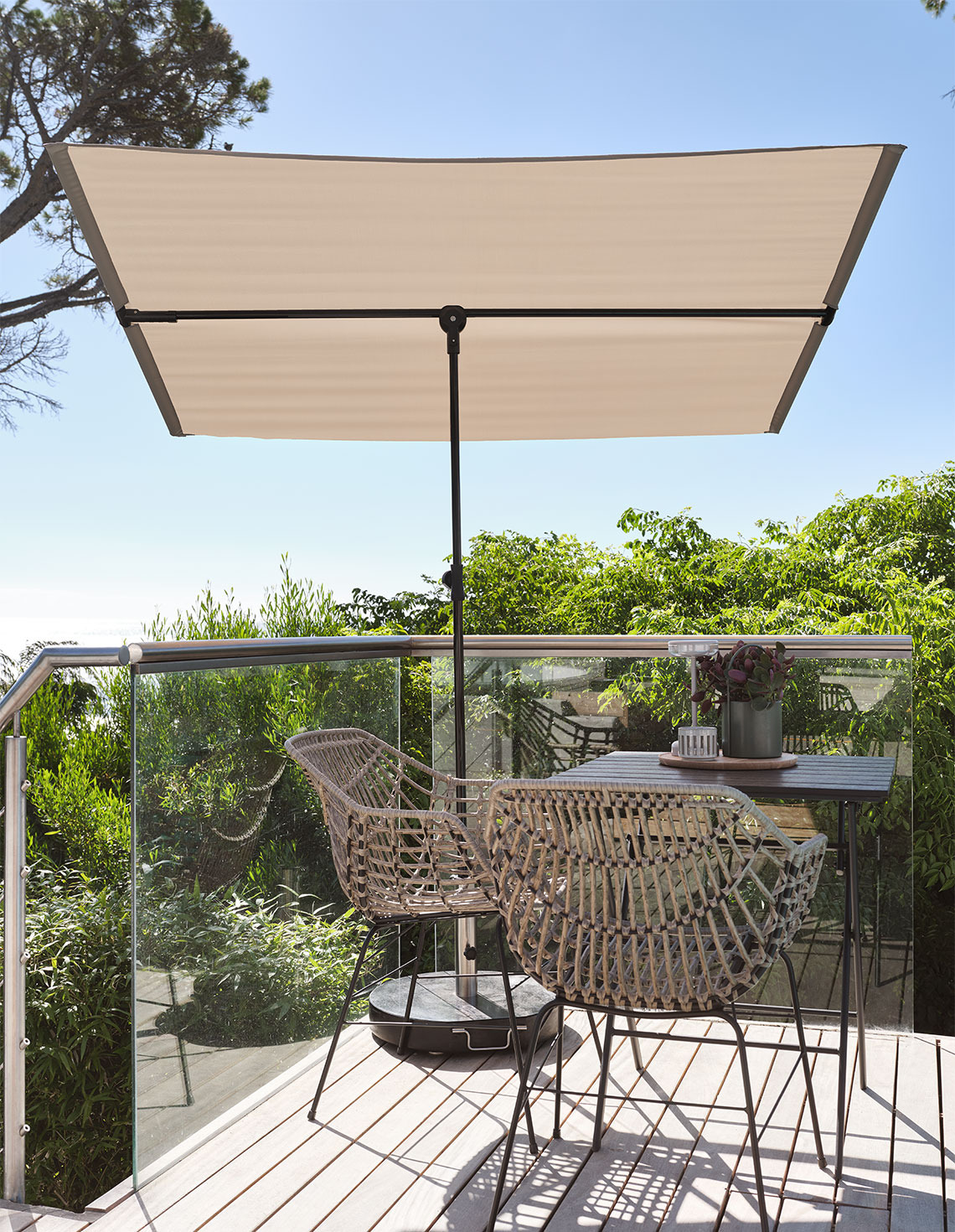 Balcony parasol on balcony with bistro set