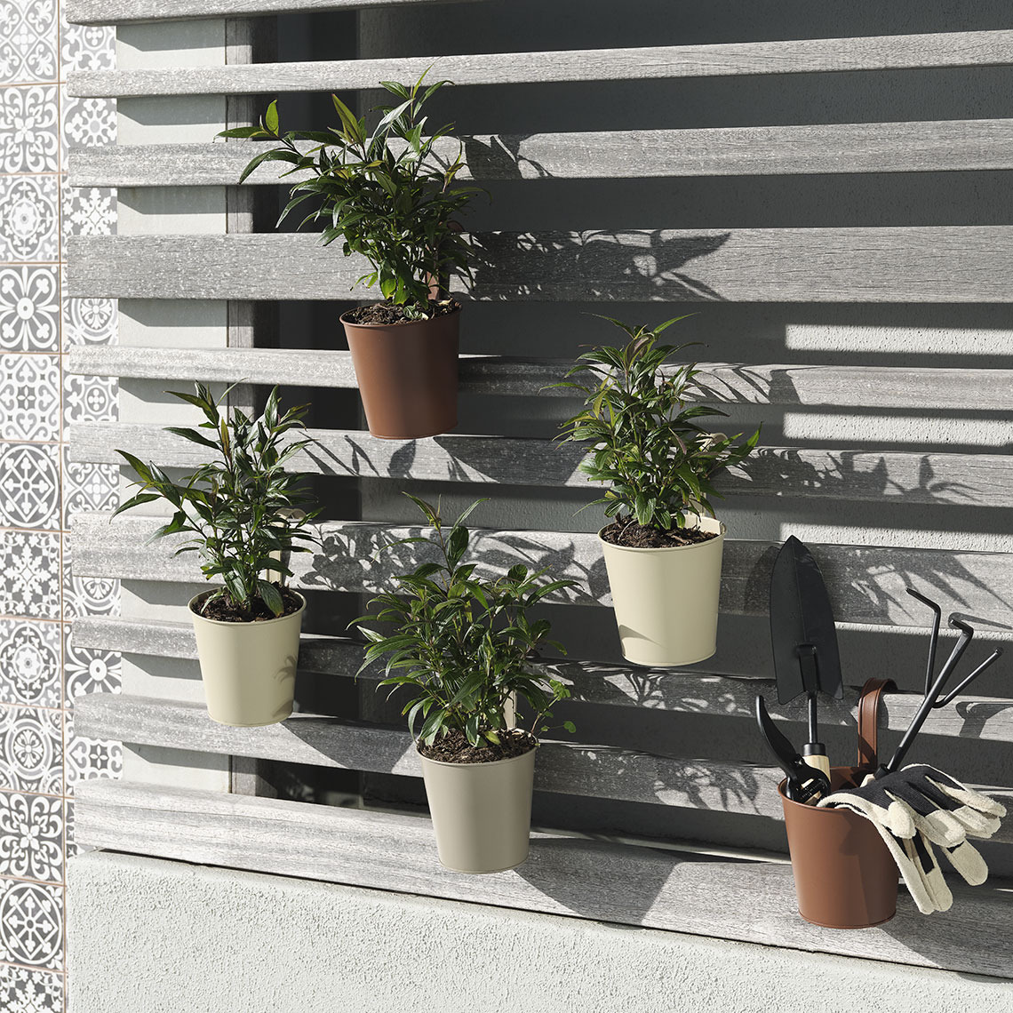 Hanging balcony plant pots in different earthy colours