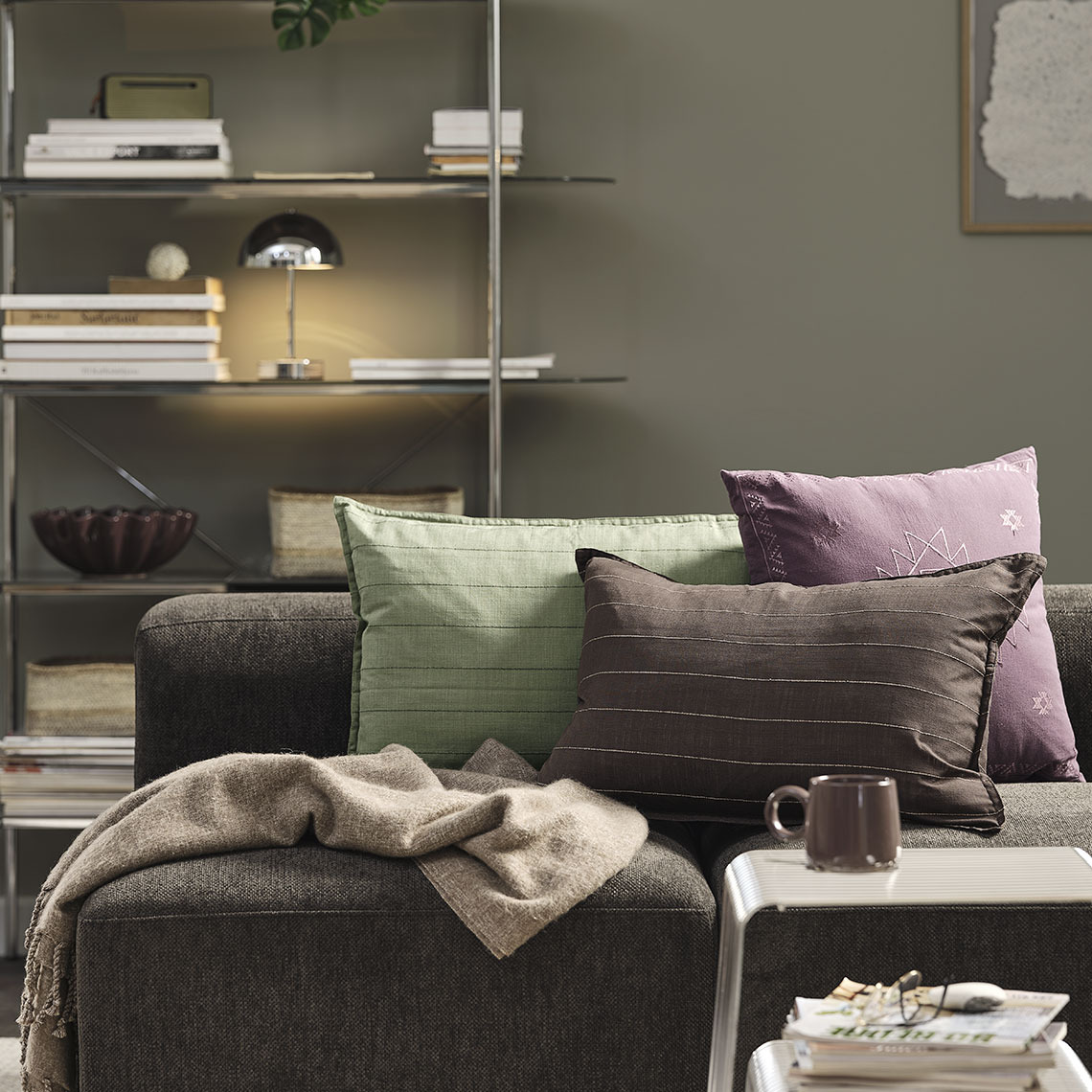 Sofa with cushions and throw
