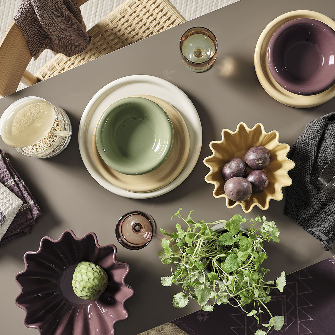 Colourful bowls and plates on a dining table 