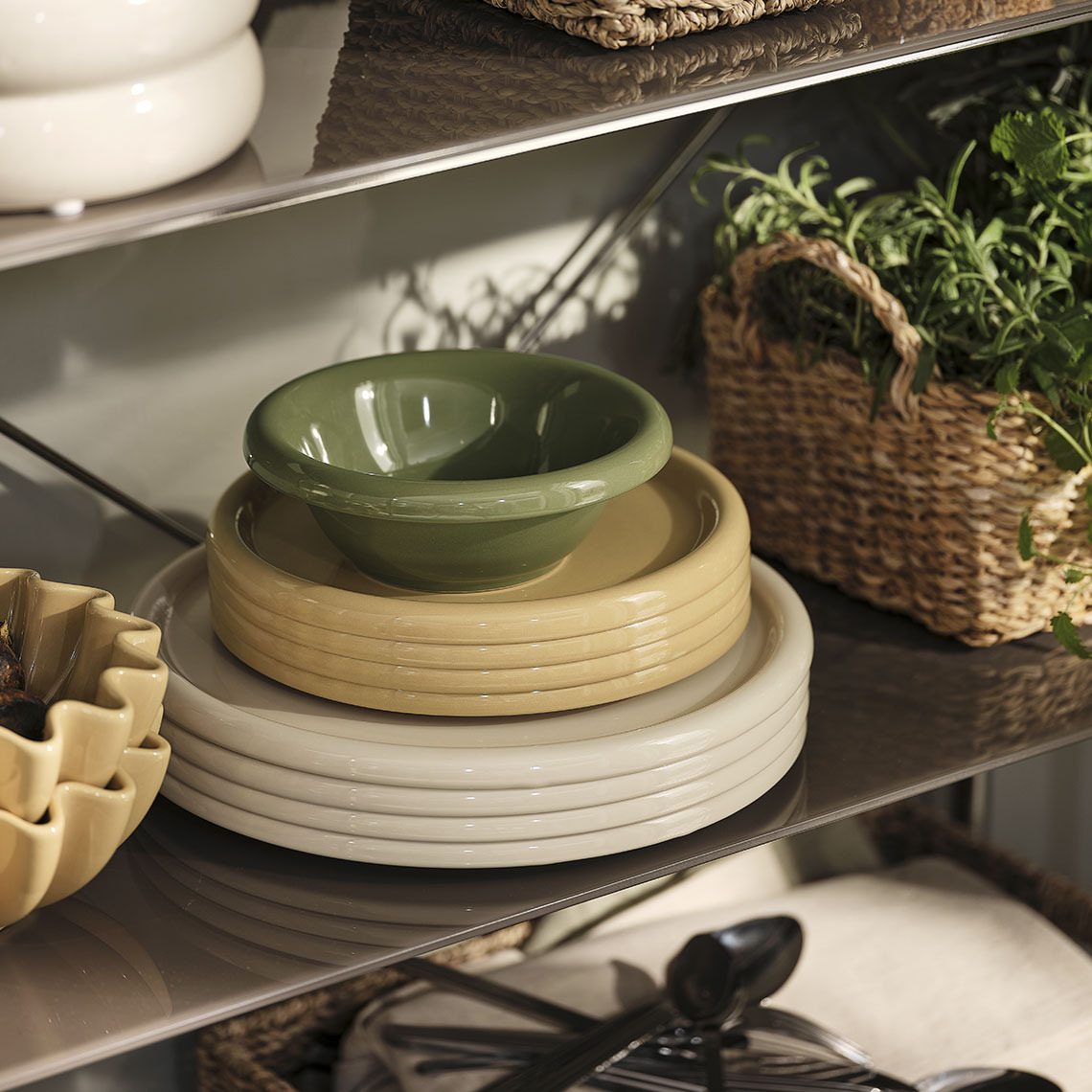 Colourful plates and bowls on a shelf