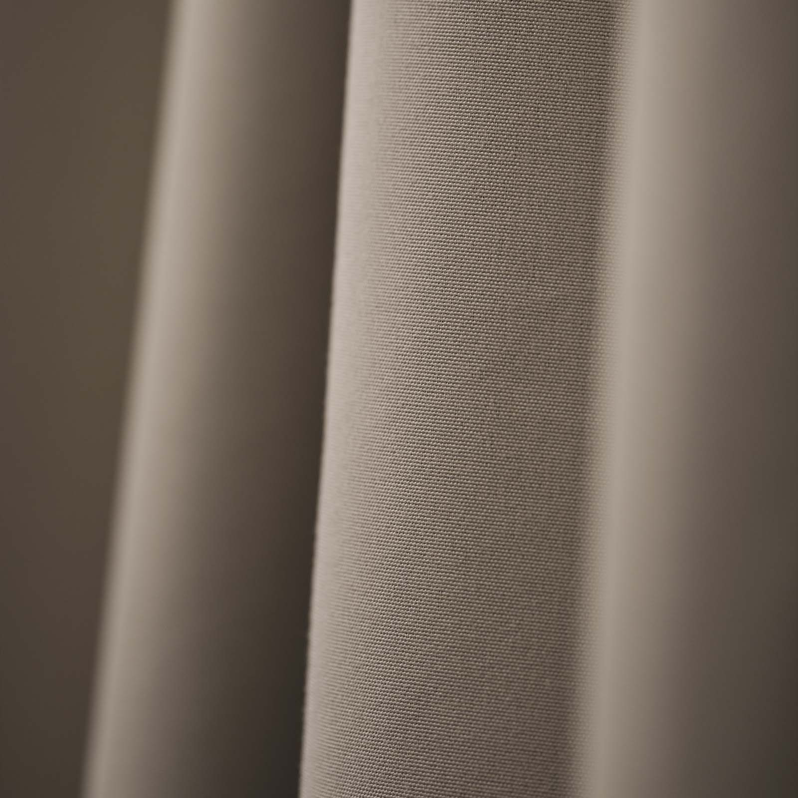 Close-up of stylish, beige-coloured blackout curtain 