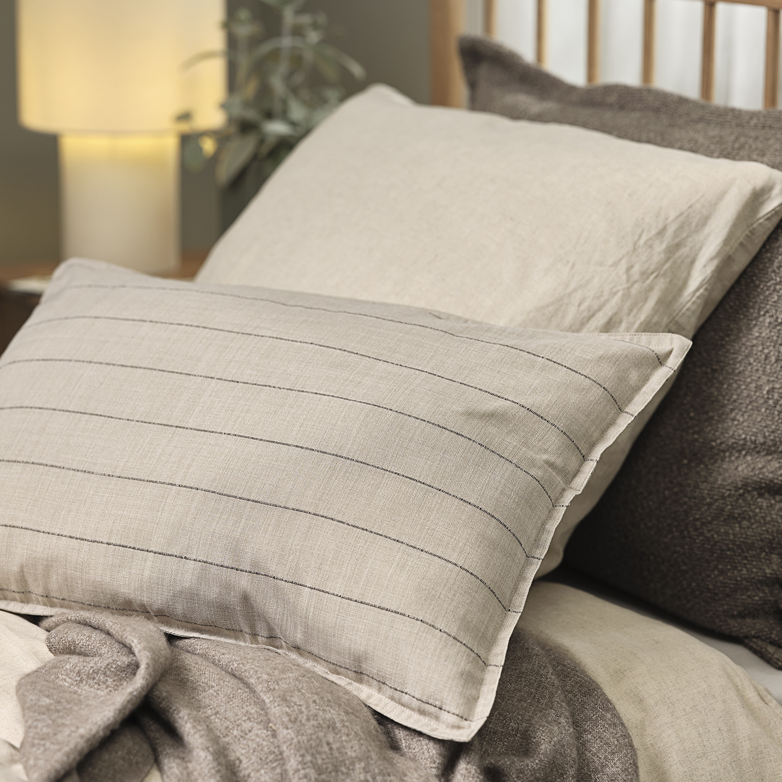 POPPEL cushion cover in sand/brown stripes Bed with two cushions