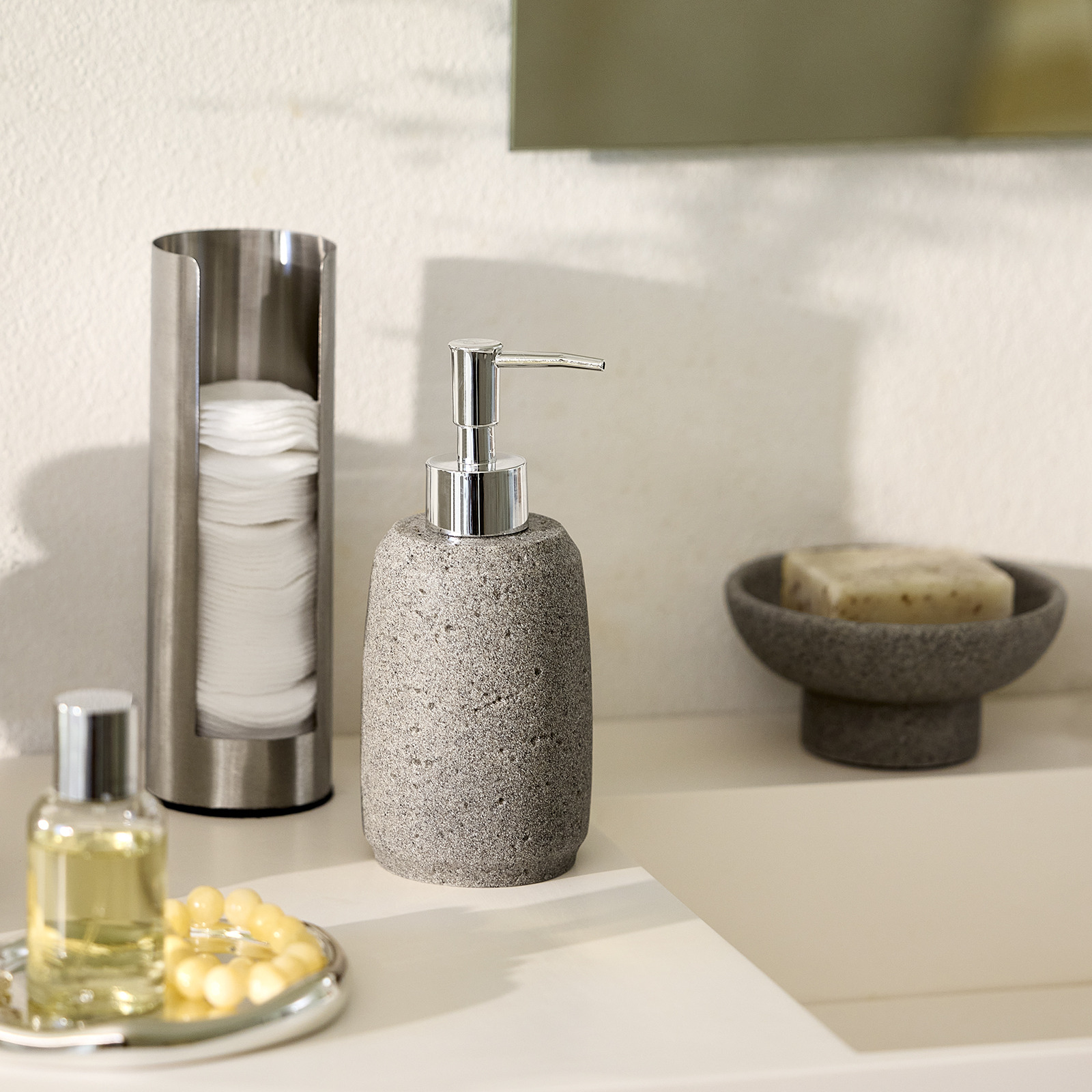 STENSELE soap dispenser and decorative bowl Soap dispenser, trinket dish and cotton pad holder by a bathroom sink